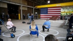 With his supporters using social distancing, Democratic presidential candidate former Vice President Joe Biden outlines his economic plan while speaking at McGregor Industries in Dunmore, Pa., July 9, 2020.