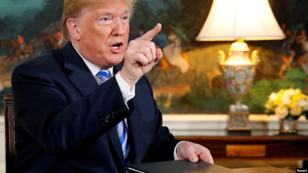 FILE - U.S. President Donald Trump speaks to reporters after signing a proclamation declaring his intention to withdraw from the JCPOA Iran nuclear agreement in the Diplomatic Room at the White House in Washington, May 8, 2018.