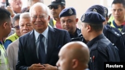 Malaysia's former Prime Minister Najib Razak arrives in court in Kuala Lumpur, Malaysia, Oct. 4, 2018.