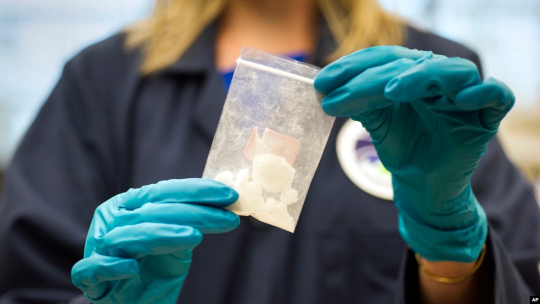 FILE - A bag of 4-fluoro isobutyryl fentanyl which was seized in a drug raid is displayed at the Drug Enforcement Administration (DEA) Special Testing and Research Laboratory in Sterling, Virginia, Aug. 9, 2016.