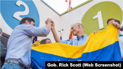 El gobernador de Florida, Rick Scott, dijo que "más de 20 millones de personas" llaman a Florida "la casa donde viven residentes de todo el mundo".