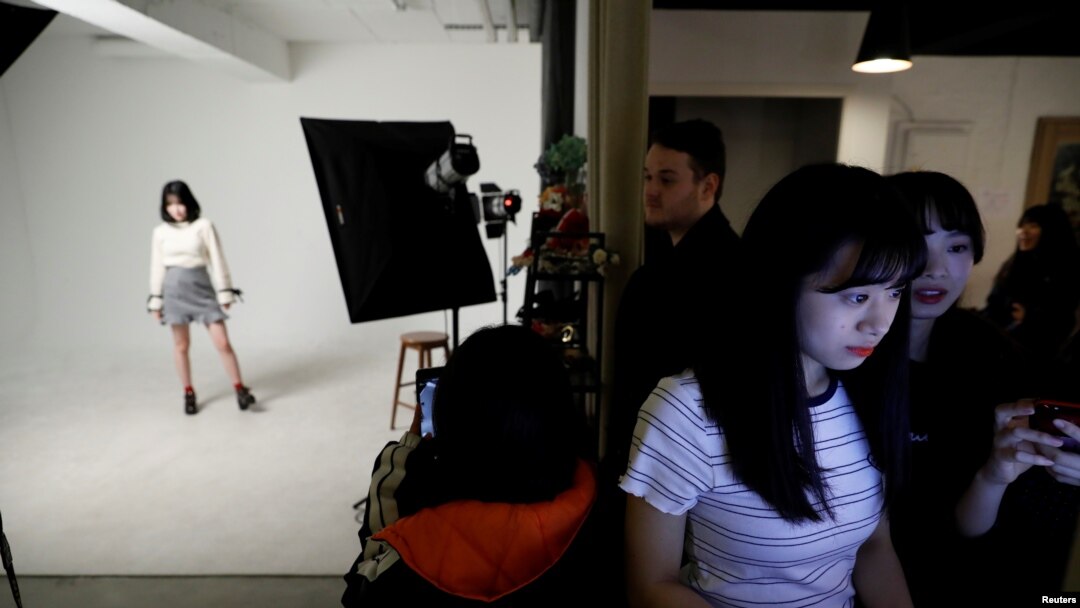 Nao Niitsu, 19, a college freshman from Tokyo, who wants to be a K-pop star, chooses her profile picture before an audition in Seoul, South Korea, March 16, 2019.