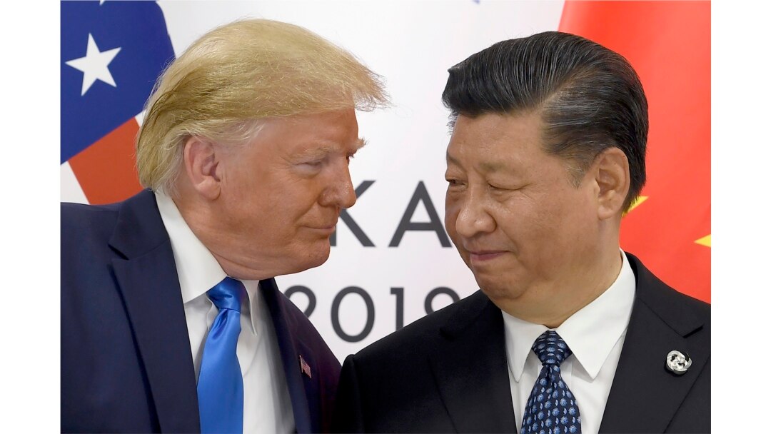 FILE - President Donald Trump meets with Chinese President Xi Jinping on the sidelines of the G-20 summit in Osaka, Japan, June 29, 2019.