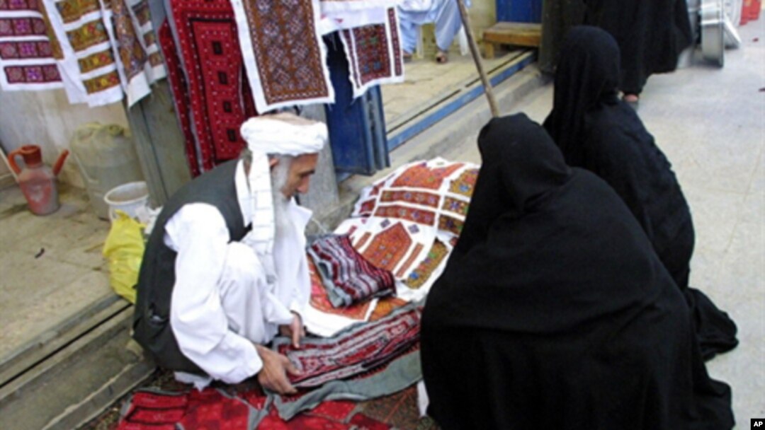 An Iranian man sells traditional embroidered fabric in the Bazaar of the southeastern city of Zahedan, on the border with Afghanistan (file photo)