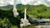 In this image taken from video footage run by China's CCTV, a projectile is launched from an unspecified location in China, Aug. 4, 2022.