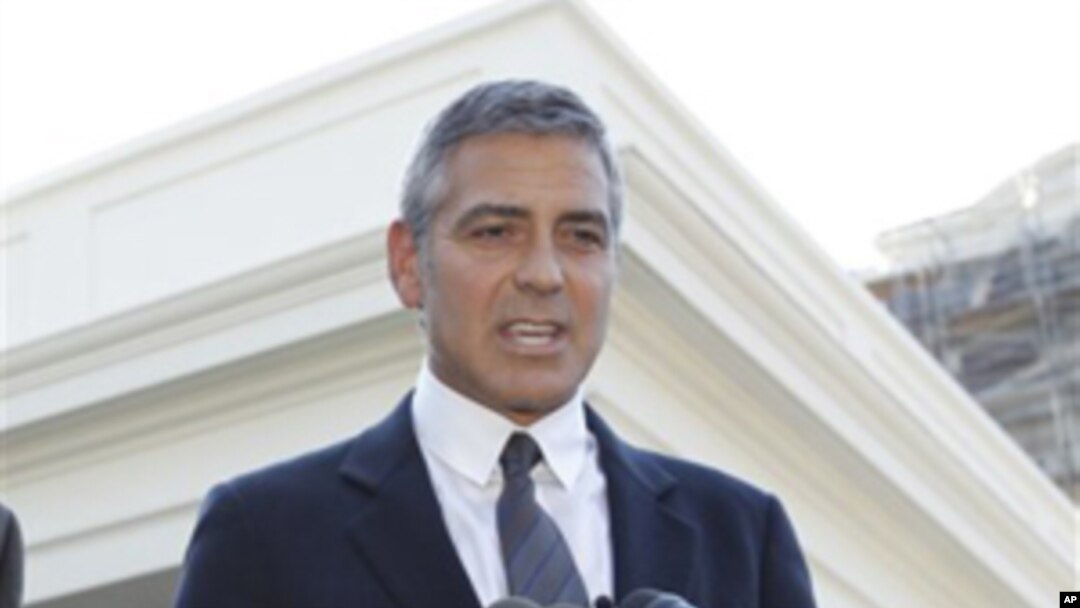 Actor George Clooney speaks to reporters after meeting with President Barack Obama about his recent trip to Sudan at the White House in Washington, Tuesday, Oct. 12, 2010. (AP Photo/Charles Dharapak)