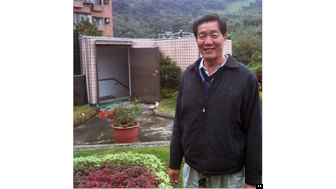 Chientan borough chief Bi Wu-liang stands on a roof of a former kindergarten set to be razed and now supporting a garden watered by captured rain.