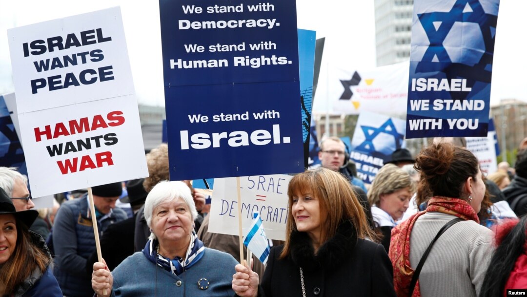 People hold placards during the "Rally for Equal Rights at the United Nations (protesting Anti-Israeli bias)" aside of the Human Rights Council at the United Nations in Geneva, Switzerland, March 18, 2019. 