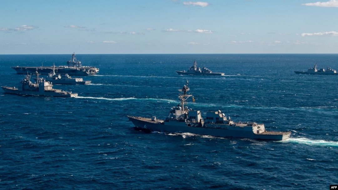 This handout photo taken by the US Navy and released Jan. 18, 2024 by the Joint Staff Office of the Defense Ministry of Japan shows the US Navy USS Kidd following the USS Carl Vinson during maritime exercises with the navies of Japan and South Korea.