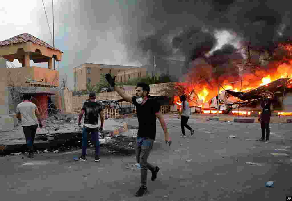 Protesters storm the governor's building during protests demanding better public services and jobs, Sept. 4, 2018, in Basra, 340 miles (550 kilometers) southeast of Baghdad, Iraq.