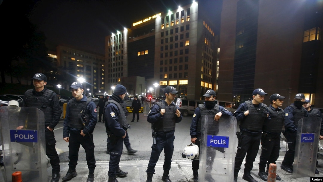 Turkish riot police stand guard in front of the Justice Palace in Istanbul. Turkish prosecutor Mehmet Selim Kiraz died during surgery for gunshot wounds. Two members of a banned leftist group, the Revolutionary People's Liberation Party, were also killed, March 31, 2015.
