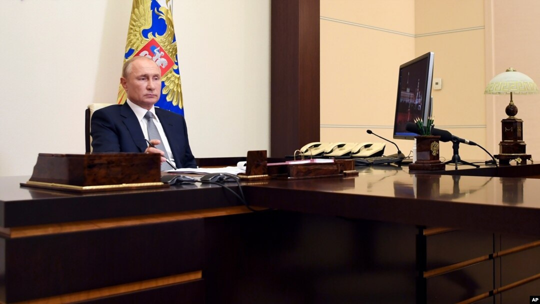Russian President Vladimir Putin attends a meeting via video conference at the Novo-Ogaryovo residence outside Moscow, Russia, Sept. 3, 2020. 