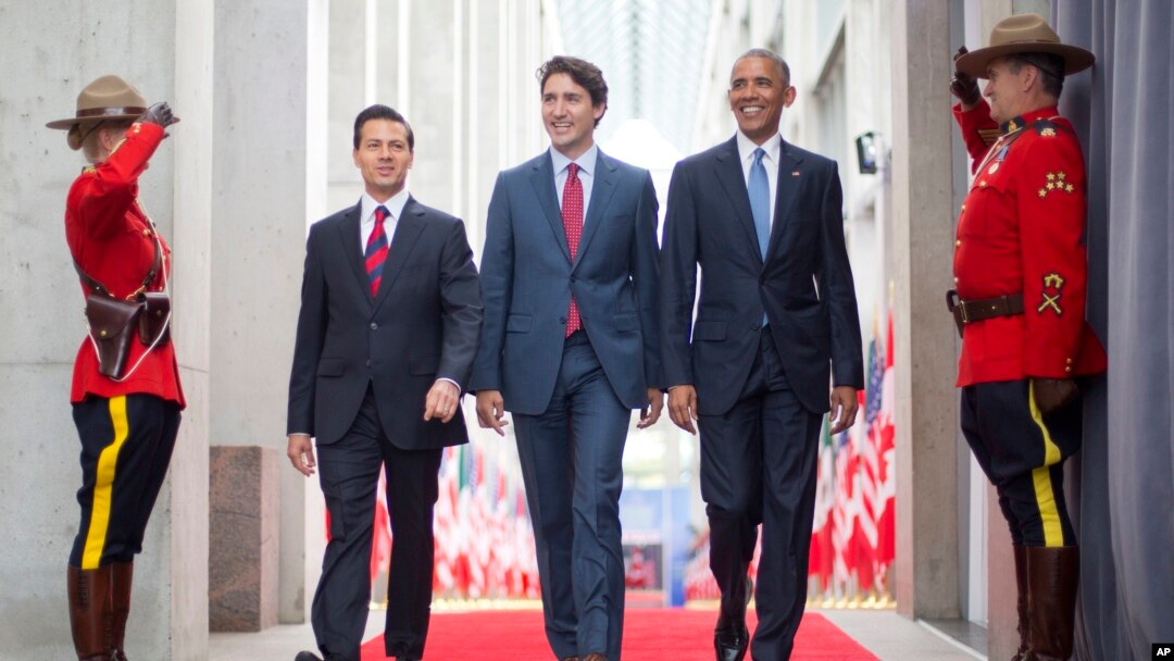 President Barack Obama (R) walks with Canadian Prime Minister Justin Trudeau (C) and Mexican President Enrique Pena Nieto at the National Gallery of Canada in Ottawa, Canada, June 29, 2016. Obama traveled to Ottawa for the North America Leaders' Summit.