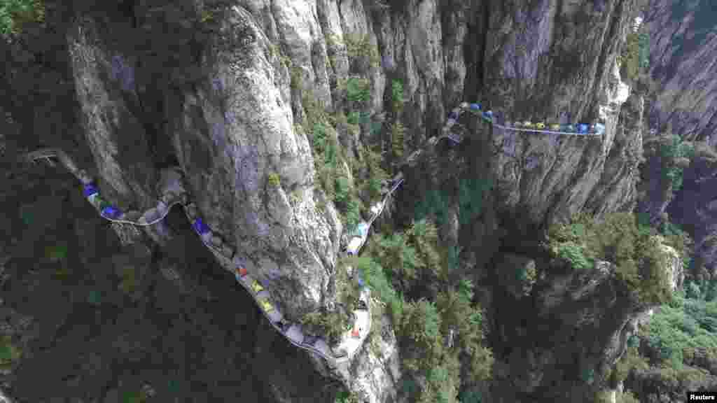 Tents are seen set up along a mountain road during a camping festival in Luoyang, Henan province, China.