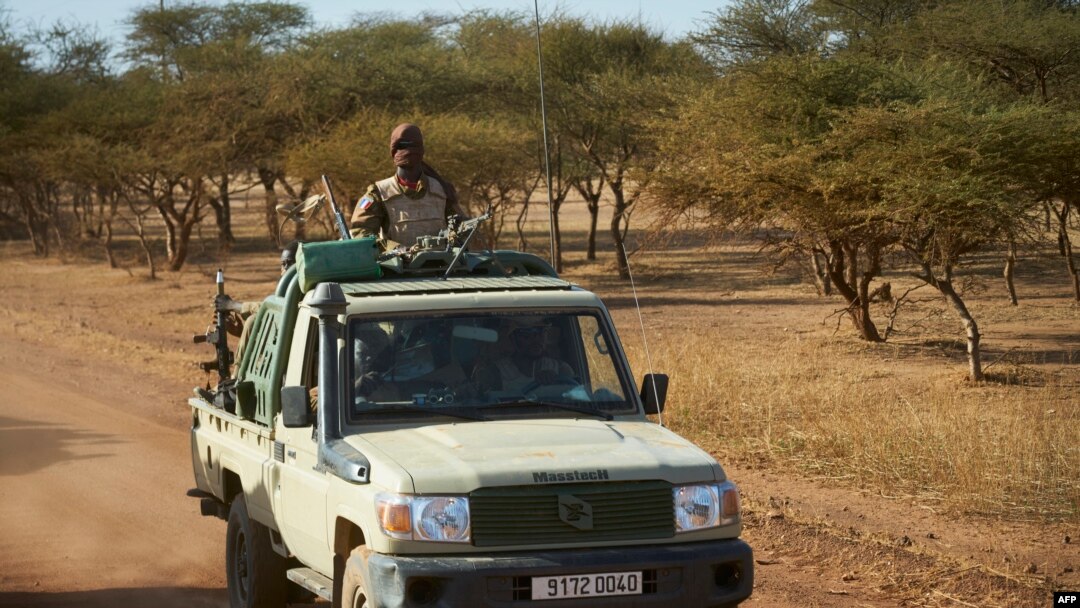 FILE - A vehicle of the Burkina Faso Army patrols a rural area in the Soum region in northern Burkina Faso, Nov. 14, 2019. 