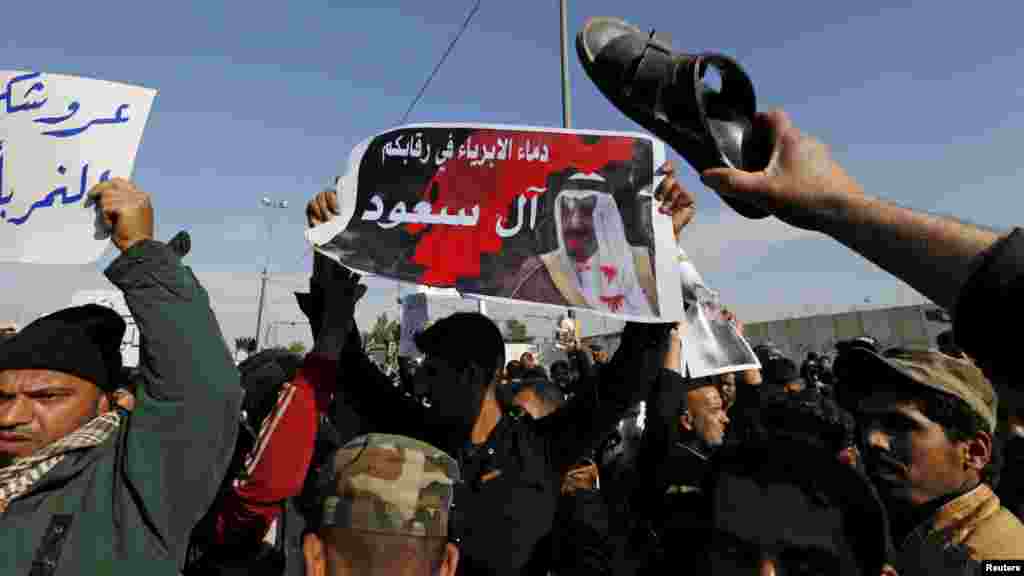 Masu Mara Ma 'Yan Shi'a Baya A Yayin Da Suke Gudanar Da Zangazangar Kin Jinin Hukucin Kisa Da Kasar Saudiyya Ta Yanke Ma Wani Malamin 'Yan Shi'a, Janairu 4, 2016. Supporters of Shi'ite cleric Moqtada al-Sadr protest against the execution of Shi'ite cleric Nimr al-Nimr in Saudi Arabia, during a rally in Baghdad, Iraq, Jan. 4, 2016.