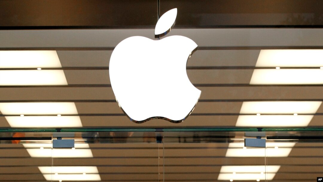 FILE - The Apple logo is seen above a store location entrance, in Dallas, Texas, Sept. 19, 2013.