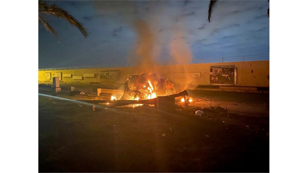 Burning debris is seen on a road near Baghdad International Airport, which according to Iraqi paramilitary groups was caused by three rockets, Jan. 3, 2020. (Social Media/Reuters)