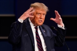 President Donald Trump gestures while speaking during the first presidential debate, Sept. 29, 2020, in Cleveland, Ohio.