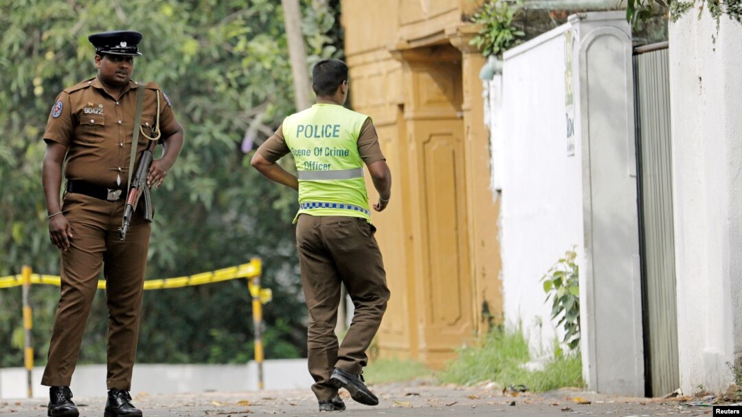 A Sri Lankan police officer walks into the motel where the Australian- and British-educated suicide bomber detonated his device inside, in Dehiwala on the outskirts of Colombo, Sri Lanka, April 26, 2019.