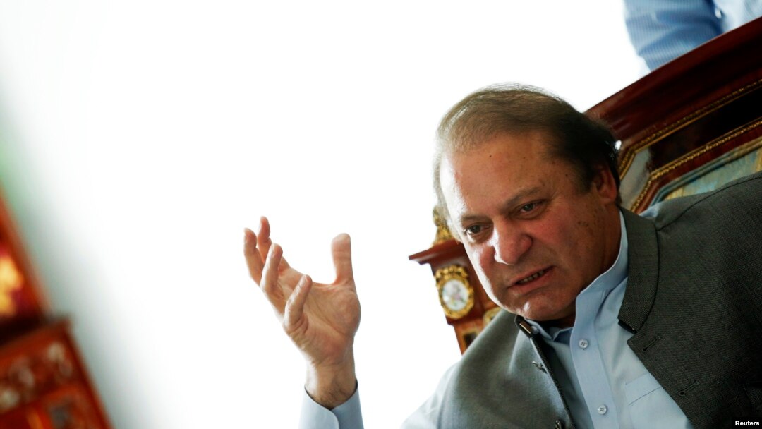 Nawaz Sharif, the leader of Pakistan Muslim League - Nawaz (PML-N), gestures as he speaks to foreign reporters at his residence in Lahore May 13, 2013. 