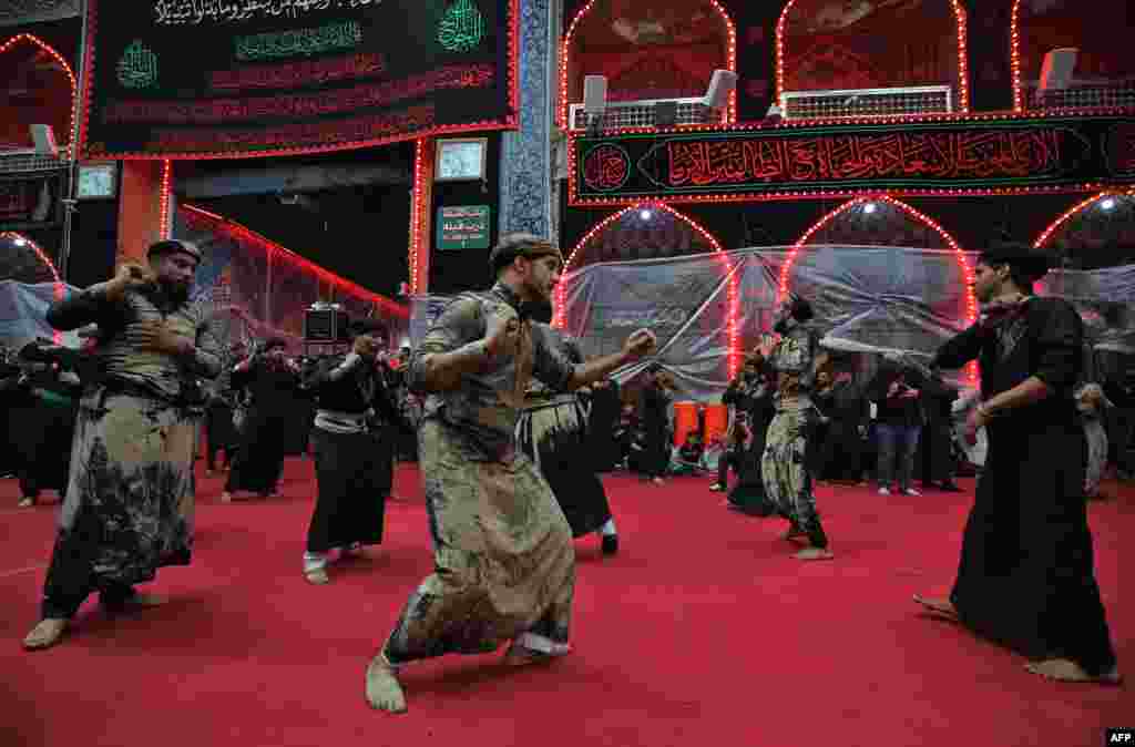 Shi'ite pilgrims take part in a ceremony during the 10-day mourning period leading up to Ashura, in Iraq's holy city of Karbala.