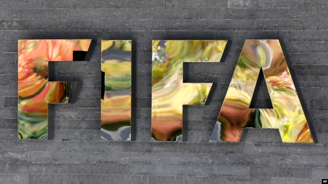 FILE - The FIFA logo is fixed on a wall of the FIFA headquarters in Zurich, Switzerland.