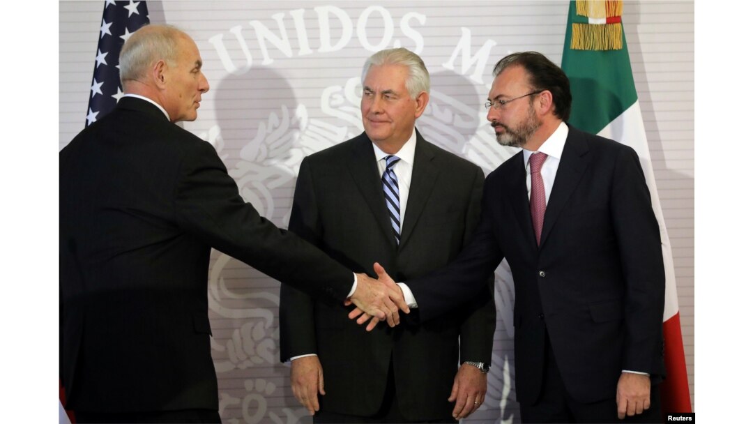 U.S. Secretary of State Rex Tillerson (center) looks at Secretary of Homeland Security John Kelly as he shakes hands with Mexico's Foreign Secretary Luis Videgaray (right) after delivering statements at the Ministry of Foreign Affairs in Mexico City, Feb.