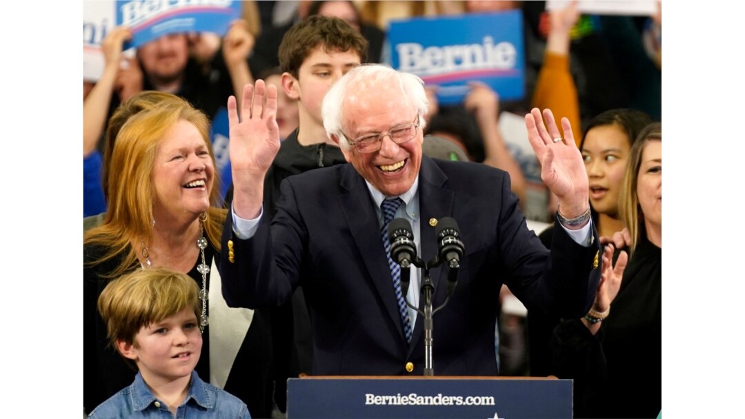 Democratic U.S. presidential candidate Senator Bernie Sanders is accompanied by his wife Jane O’Meara Sanders and other relatives as he speaks at his New Hampshire primary night rally in Manchester.