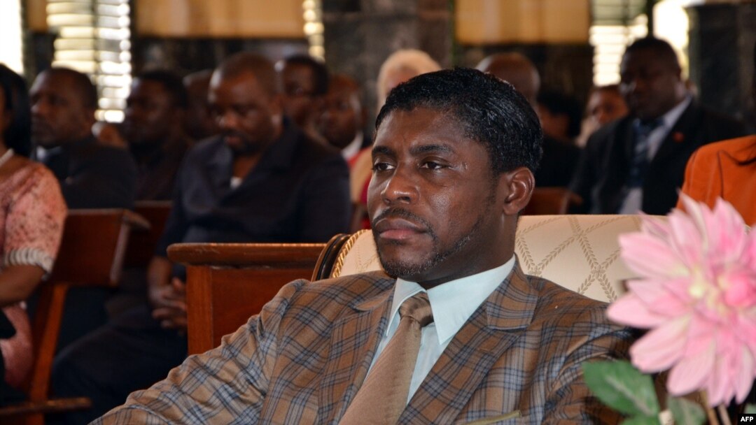 FILE - Teodorin Obiang Nguema, the son of Equatorial Guinea's president Teodoro Obiang Nguema sits during a mass at Malabo's Cathedral to celebrate his 41st birthday, June 25, 2013.