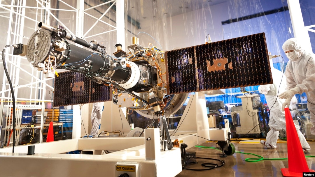 The fully integrated spacecraft and science instrument for NASA's Interface Region Imaging Spectrograph (IRIS) mission is seen in a clean room at the Lockheed Martin Space Systems Sunnyvale, California facility in this undated NASA handout photo.