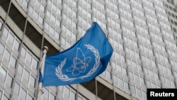 The flag of the International Atomic Energy Agency (IAEA) flies in front of its headquarters in Vienna, Austria, Jan.15, 2016. 