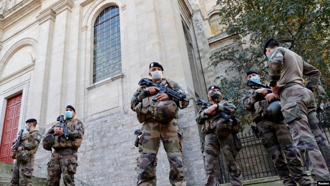French soldiers, part of France's national security alert system "Sentinelle", patrol near the Cathedral in Arras as France has raised the security alert for French territory to the highest level after the knife attack in the city of Nice, France.