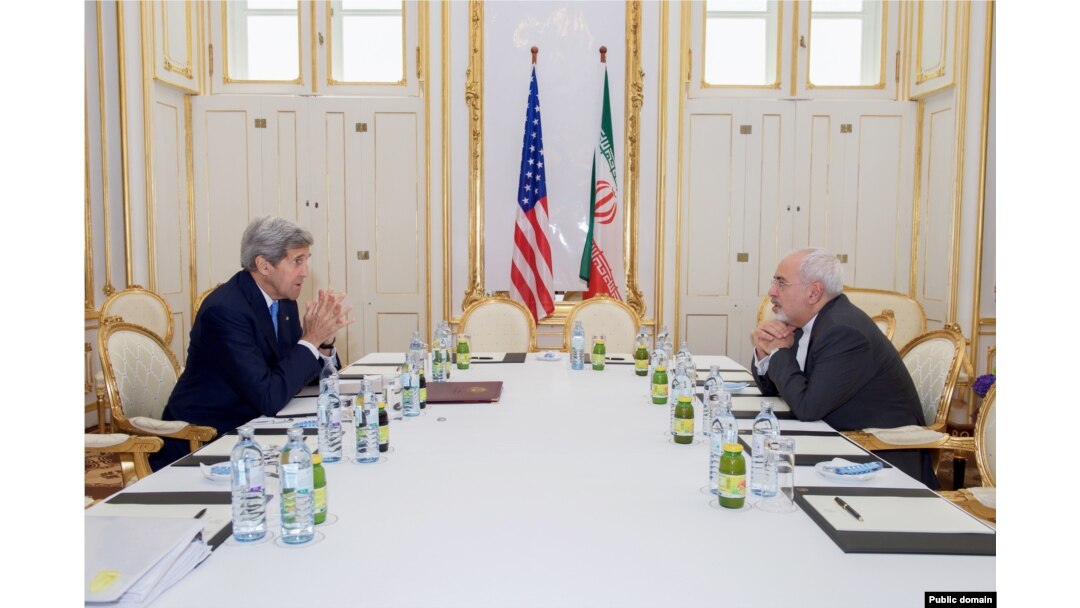 FILE - U.S. Secretary of State John Kerry sits across from Iranian Foreign Minister Javad Zarif on June 30, 2015, in Vienna, Austria, before a one-on-one meeting. (Photo: State Department)