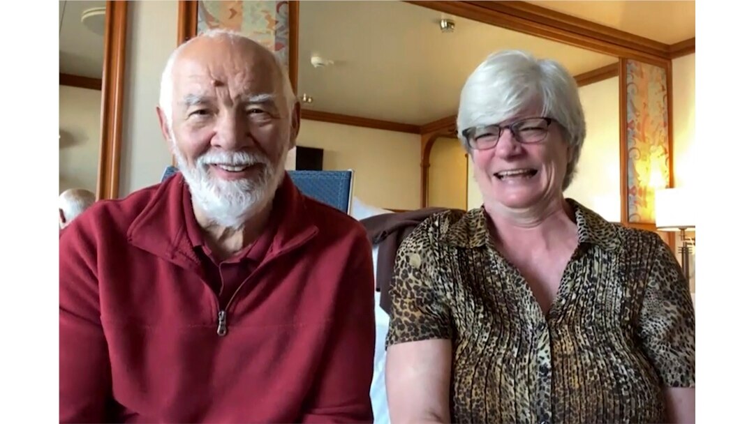 In this image from a video taken on Wednesday, Feb. 12, 2020, Paul Molesky and Cheryl Molesky are interviewed through Skype in their cabin room on the Diamond Princess, anchored at a port in Yokohama, near Tokyo.