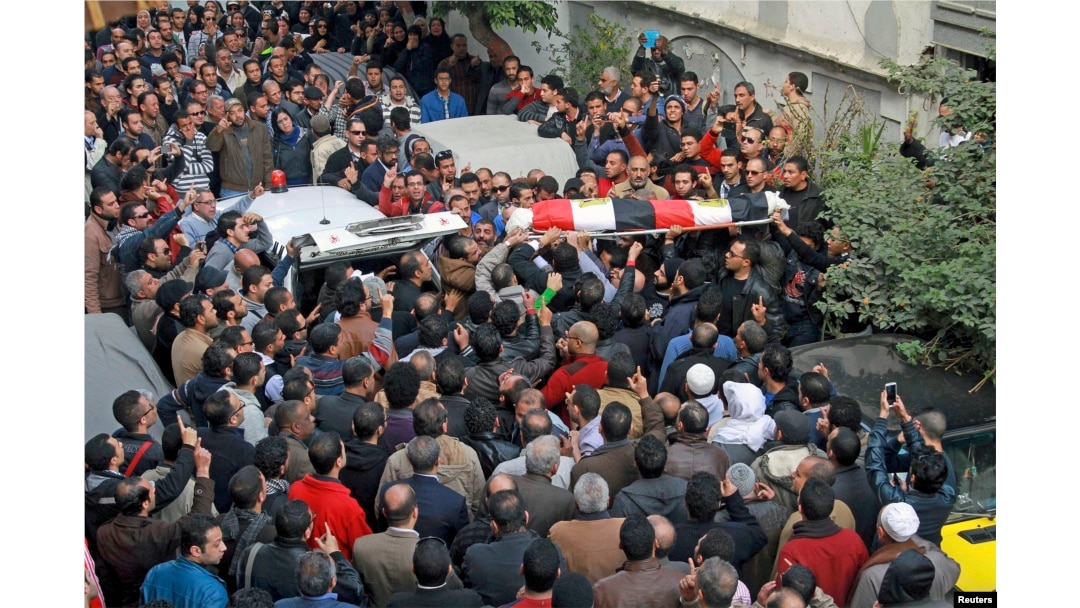 Relatives, friends and other mourners attend the funeral of Shaimaa al-Sabbagh, an activist at the Socialist Popular Alliance Party, during her funeral in Alexandria, Egypt, January 25, 2015.
