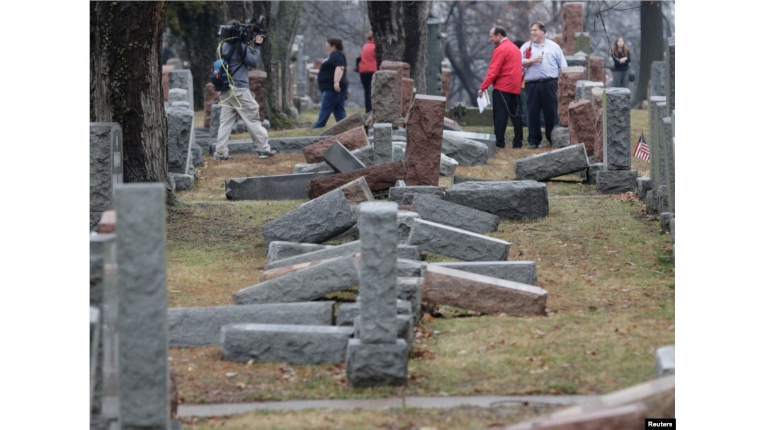 Local and national media report on more than 170 toppled Jewish headstones after a weekend vandalism attack on Chesed Shel Emeth Cemetery in University City, a suburb of St Louis, Missouri, Feb. 21, 2017.