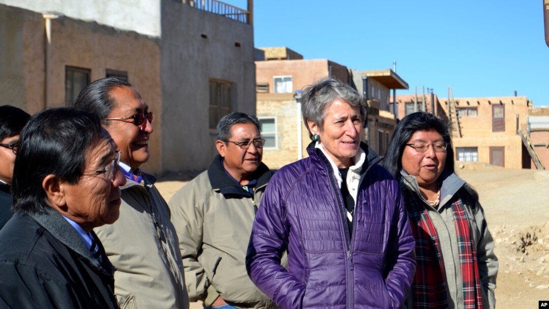 FILE - U.S. Interior Secretary Sally Jewell, second from right, tours Acoma Pueblo, a nearly thousand-year-old village that's situated atop a New Mexico mesa, with tribal leaders on Thursday, Dec. 8, 2016.