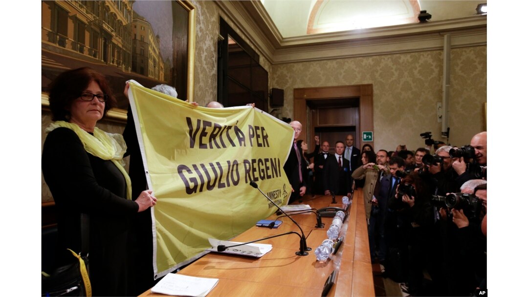 Paola, the mother of Giulio Regeni, holds a banner reading: Truth for Giulio Regeni, prior to the start of a press conference held at the Italian Senate, in Rome, Tuesday, March 29, 2016.