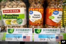 Imported nuts from the United States are displayed at a supermarket in Beijing, March 23, 2018. China announced a $3 billion list of U.S. goods including pork, apples and steel pipe on Friday that it said may be hit with higher tariffs.