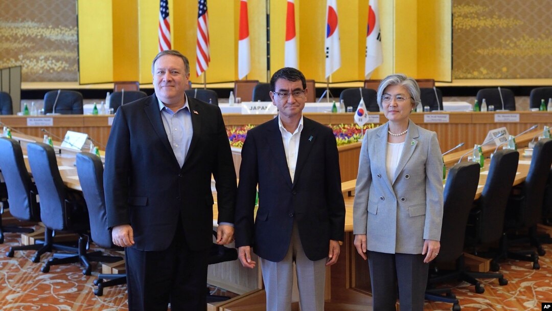 From left, U.S. Secretary of State Mike Pompeo, Japan's Foreign Minister Taro Kono, and South Korea's Foreign Minister Kang Kyung-wha pose for photo at the Iikura Guest House in Tokyo, Japan, July 8, 2018.