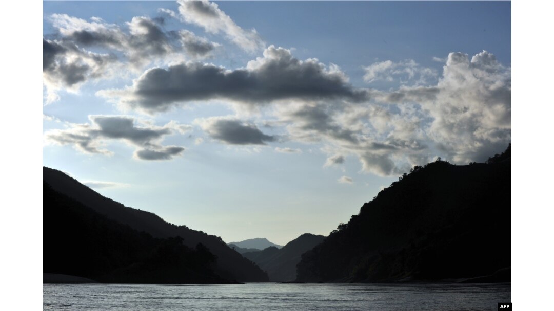 FILE - The sun sets over the Mekong river Oct., 16, 2009, near Pak Beng in northern Laos near the Thai border.