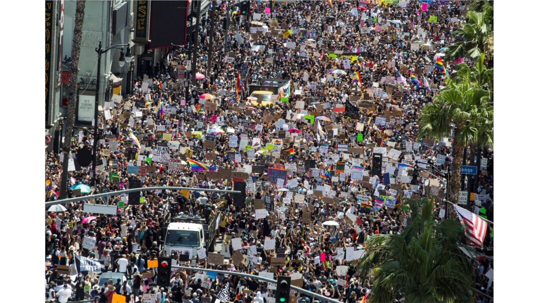 People take part in an All Black Lives Matter march, organized by Black LGBTQ+ leaders, in the aftermath of the death in Minneapolis police custody of George Floyd, in Hollywood, Los Angeles, California, U.S., June 14, 2020.