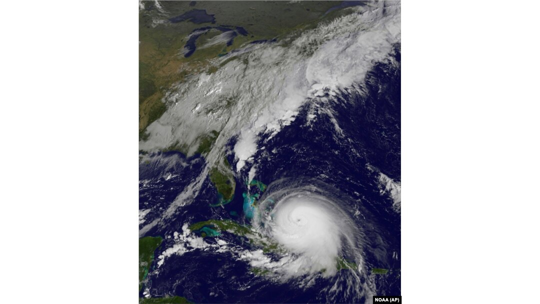 This satellite image taken Oct. 1, 2015, at 9:37 a.m. EDT, and released by the National Oceanic and Atmospheric Administration (NOAA), shows Hurricane Joaquin. The Category 4 hurricane pounded lightly populated islands of the eastern Bahamas Thursday.