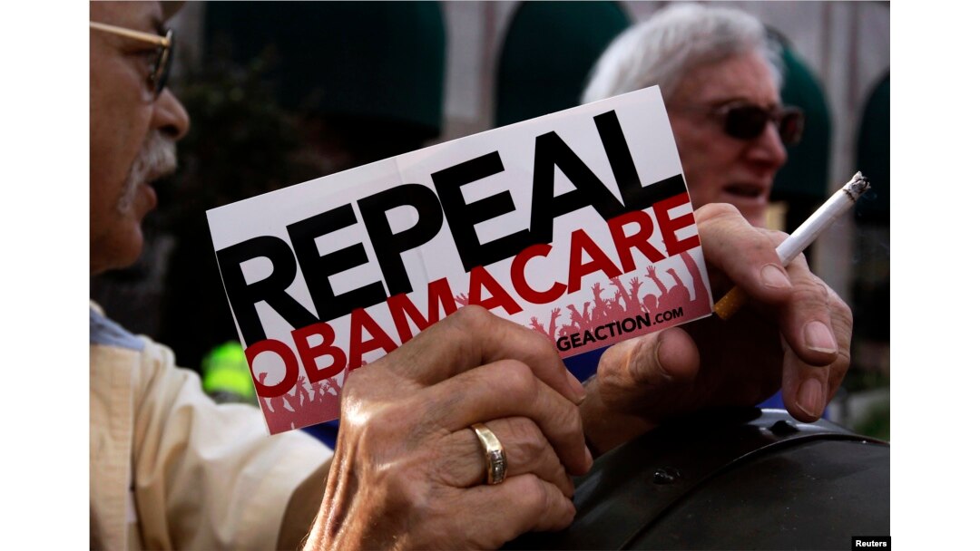 FILE - Demonstrators denouncing Obamacare during a protest in Indianapolis, Indiana, Aug. 26, 2013.