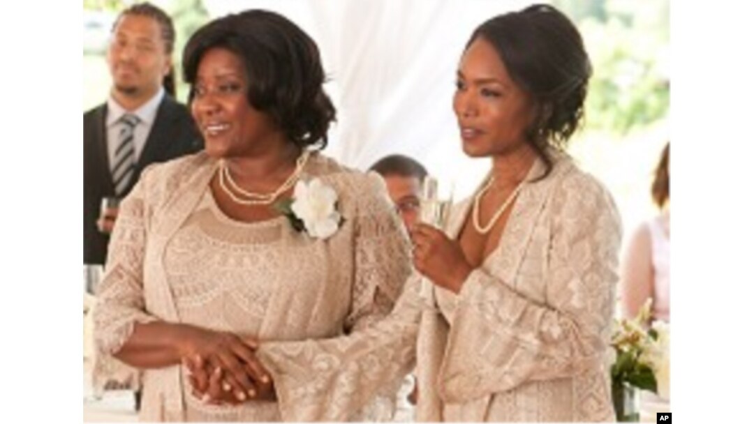 Loretta Devine, left, and Angela Bassett in a scene from "Jumping The Broom"