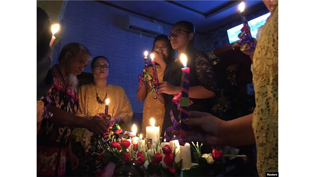 Residents affected by the tsunami attend a Mass during Christmas at Rahmat Carita Pentecostal Church near Carita in Pandeglang, Banten province, Indonesia, Dec. 25, 2018.