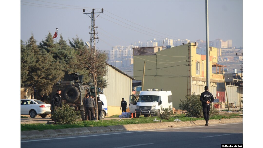Turkish authorities prepare to detonate an explosive that hit Rehyanli, Turkey on Jan. 31, 2018 and did not immediately explode.