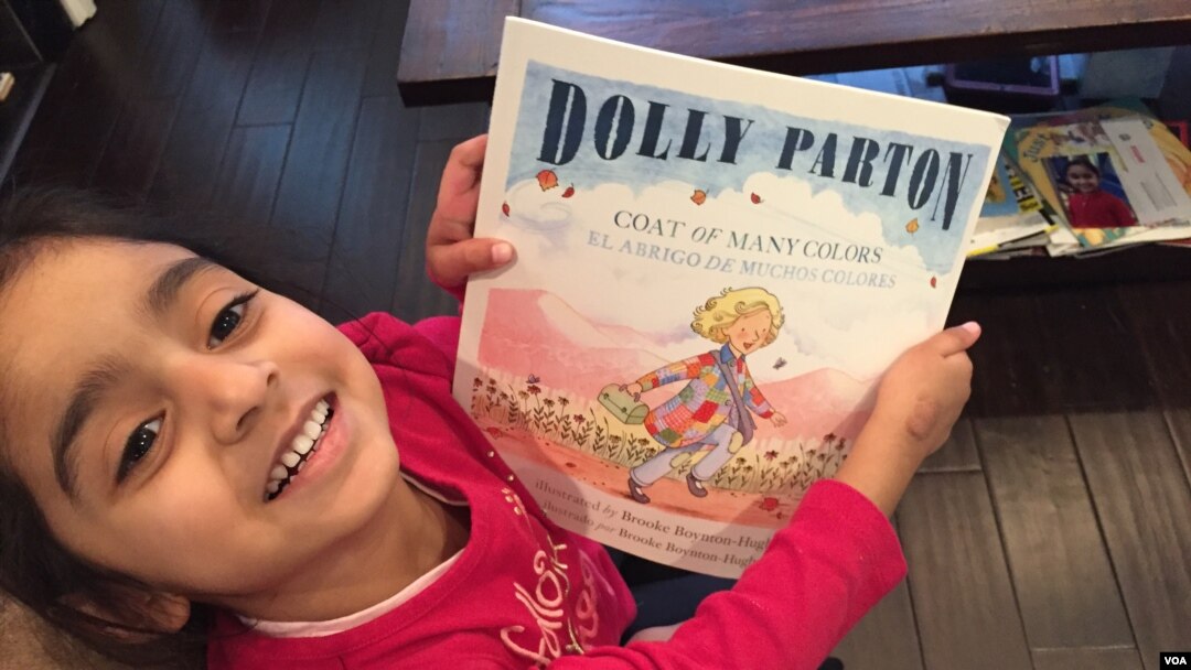 DC resident Jasmine Panchal, four, shows off her latest Books from Birth selection. (J.Taboh, VOA)