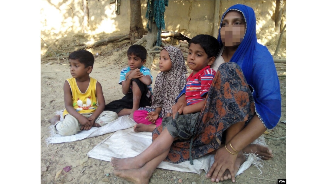 FILE - To escape violence in Rakhine state during the military crackdown there, in November 2016, Rohingya woman Haresa Begum fled to Bangladesh with her four children, leaving her husband in Myanmar.